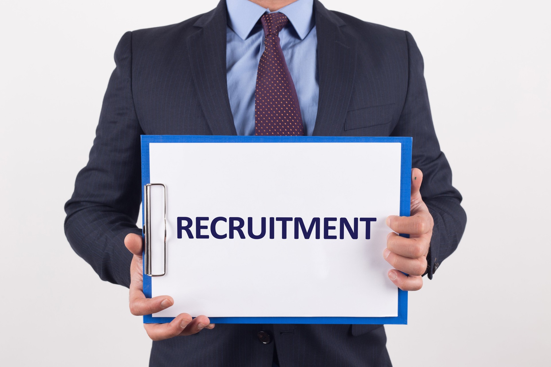 Man showing paper with RECRUITMENT text